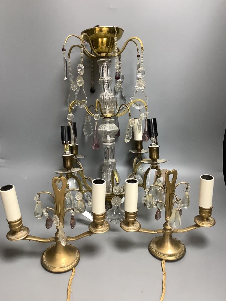 A French boudoir four-light chandelier with clear and amethyst glass pendant drops and a similar pair of French two-light bedside lamps H 57.5cm Dia 36cm